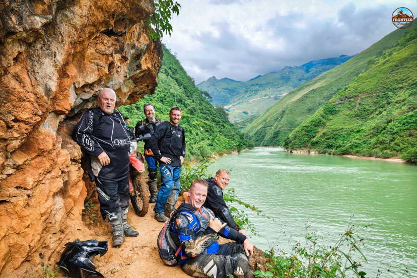 Group of experienced big bike riders preparing for a North Vietnam adventure, ideal for long-distance motorcyclists, travelers seeking unique routes, and photography enthusiasts capturing iconic mountain landscapes.